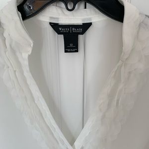 Sheer top with petal detail.